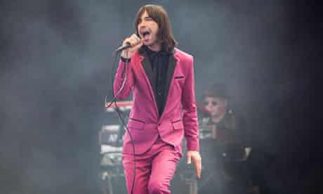 Bobby Gillespie of Primal Scream performing on the Pyramid stage at Glastonbury 2013
