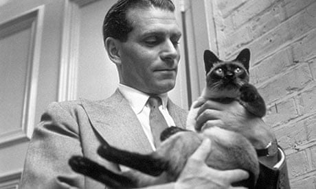 Olivier with the family cat at home at Chelsea, London, in 1946