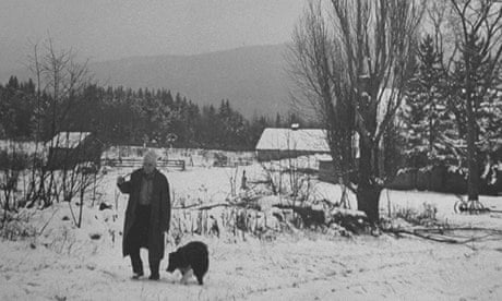 Poet Robert Frost in snowy woods in the US, around 1943