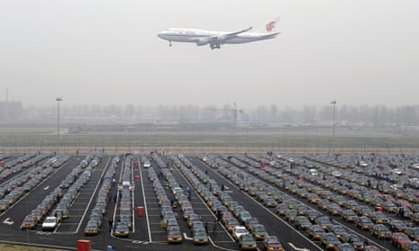 An Air China jetliner descends at Beijing airport