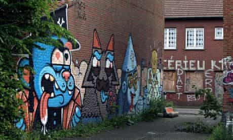 Writing on the wall? … creations by the street artists Resto and Bue in the Belgian village of Doel.