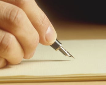 A man's hand writing