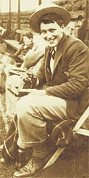 Roald Dahl in his Repton School uniform, holding his camera