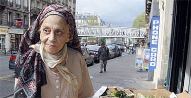 Lucie Ceccaldi, mother of French writer Michel Houellebecq poses at fruit stand in Paris on April 28, 2008. 