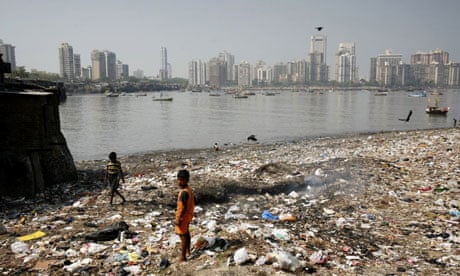 Children playing in the rubbish of a shanty town at Nariman Point, Mumbai