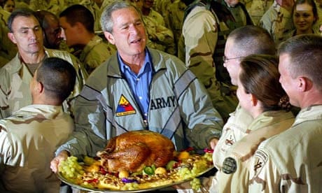 George Bush serves a Thanksgiving turkey to US troops stationed in Baghdad in 2003