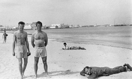 Peter Orlovsky, left, Jack Kerouac and William S. Burroughs (fully clothed) on a beach in Tangier