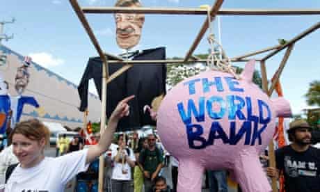Activists carry an effigy of World Bank president Robert Zoellick at a protest in Cancun last year 