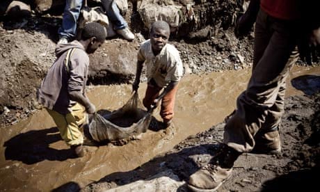 Children wash copper in Congo