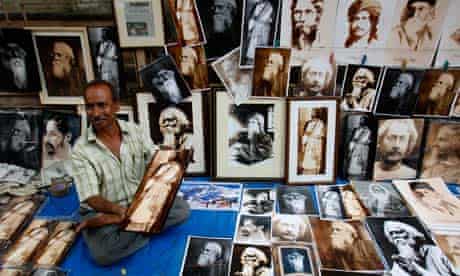A street vendor sells photographs of Tagore