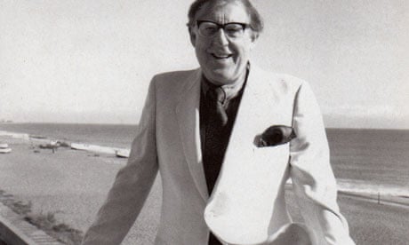 Herbert Lomas in a white jacket by the sea
