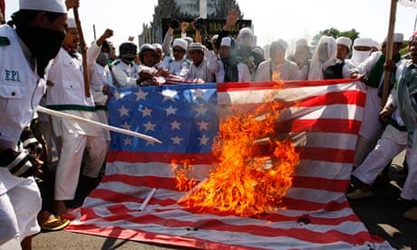 Indonesian Muslims burn an American flag during a protest against the film Innocence of Muslims