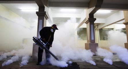 Malaysian health official sprays anti mosquito spray