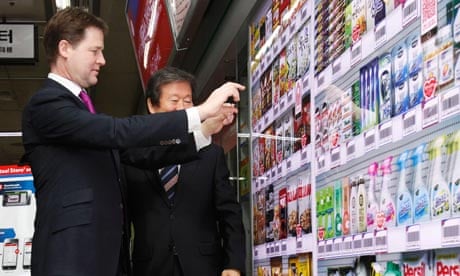 Britain's Deputy PM Clegg tries out a virtual store at a subway station in Seoul