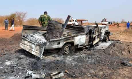 A burnt-out vehicle lies near the border town of Heglig
