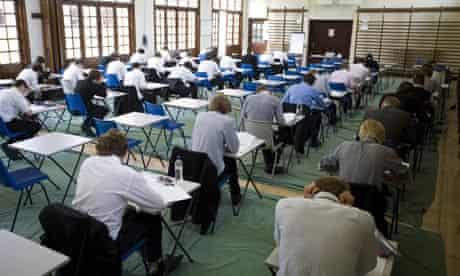Schoolchildren sitting an exam in a school hall