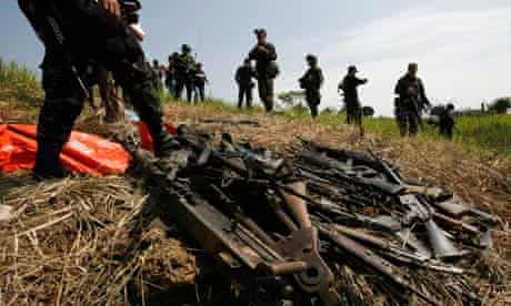 Philippine soldiers recover illegal weapons from a private army