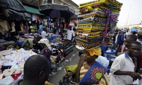 A woman sells material in a market in Ivory Coast's commercial capital, Abidjan