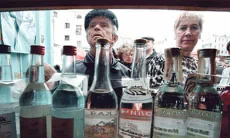 People buy vodka in a Moscow street kiosk