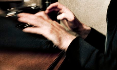 Man using typewriter