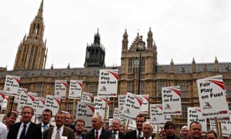 Truck drivers protest against fuel prices outside the Houses of Parliament in Westminster, London