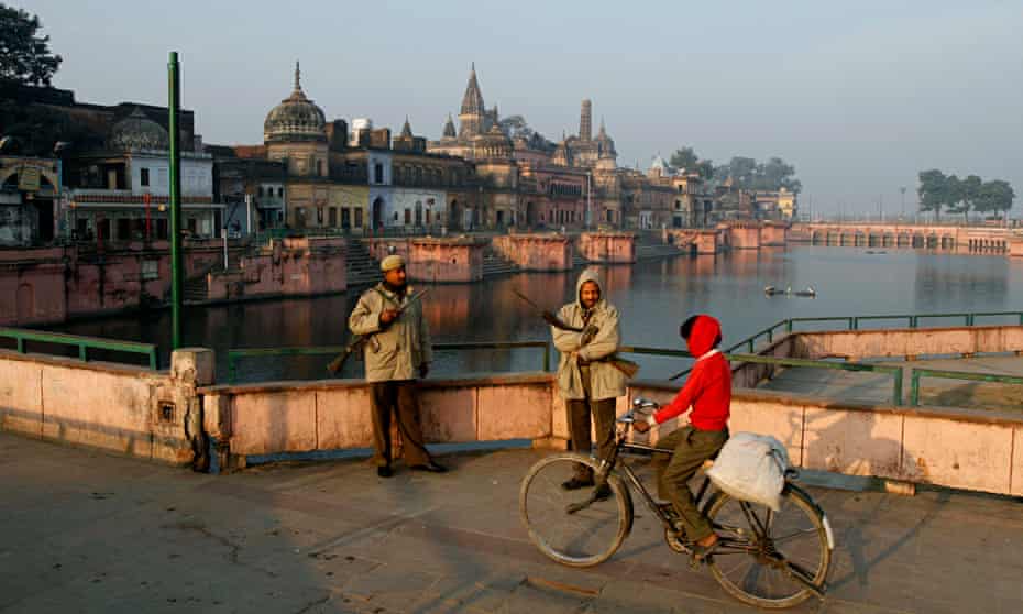 Political crises … policemen stand guard near a Hindu temple in Ayodhya, India, on the 20th annivers