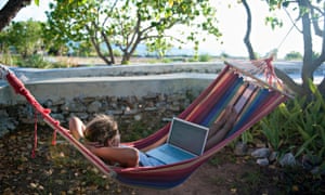 woman in hammock with laptop