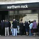 Customers queue outside a branch of Northern Rock. Photograph: Sang Tan/AP