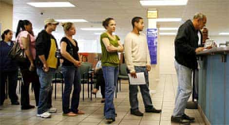 People wait at an employment help centre in Miami, Florida as US unemployment hits the worst levels since 1974