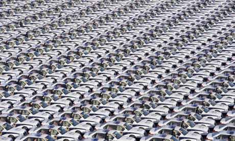 Chinese police officers stand alongside new vehicles during a handover ceremony in Taiyuan