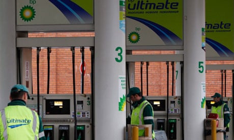 Pump attendants work at a BP petrol station in Moscow