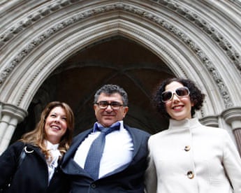Property magnate Vincent Tchenguiz poses with members of his legal team at the high court in 2011