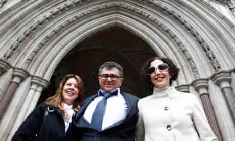 Property magnate Vincent Tchenguiz poses with members of his legal team at the high court in 2011