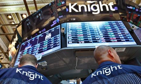 Knight Capital traders work at the company's kiosk on the floor of the New York Stock Exchange
