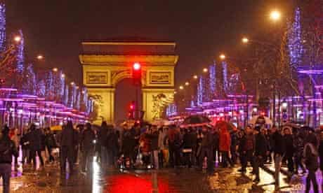 Revellers gather to celebrate the New Year in Paris, 2013