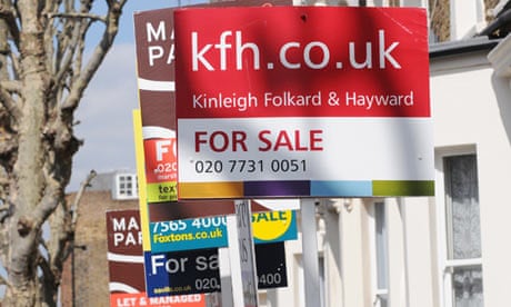 Property sale signs are seen in west London