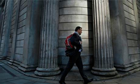 A man passes the Bank of England