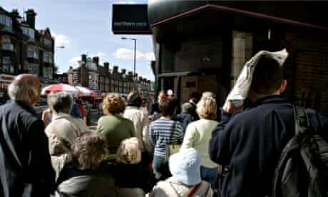 Customers queue outside a branch of Northern Rock, 2007