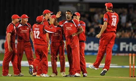 Lancashire's Farveez Maharoof, third right, is congratulated after bowling Ben Brown