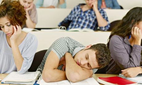Bored college students sleeping in lecture hall