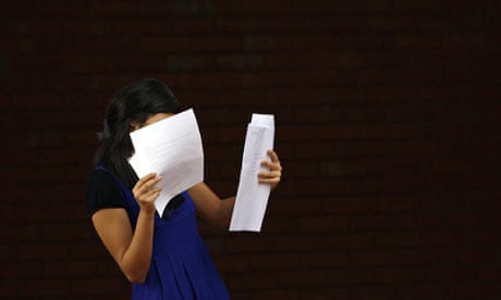 A girl looks at her A-level exam results at Withington girls school in Manchester