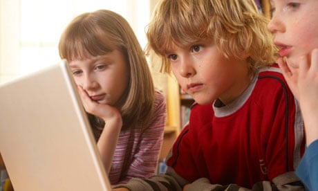Children work on computer