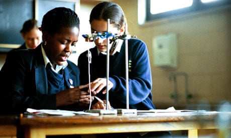 Pupils conducting an experiment during a science lesson at Salisbury Secondary School, Enfield