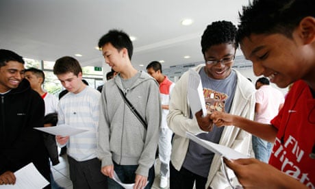 Boys collect their GCSE results. More exam-like conditions may favour them in the future