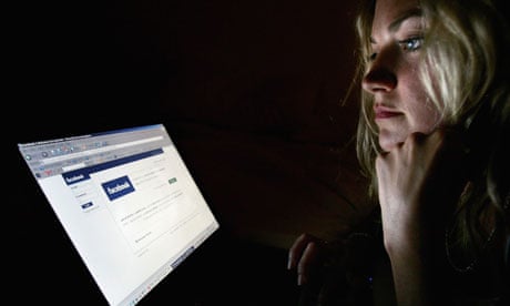 Woman looks at facebook