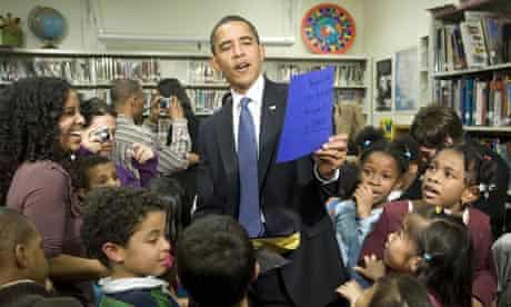 US President Barack Obama (C) looks at c