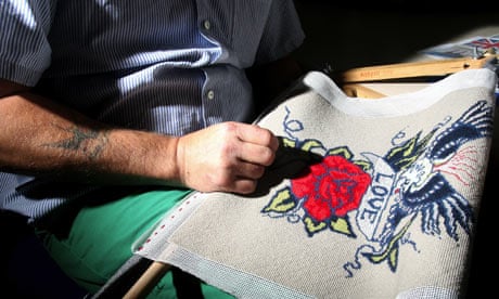 Inside HMP Albany on the Isle of Wight, prisoners work on embroidery during a class