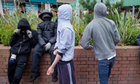 Youths gather in the centre of West Bromwich in late afternoon,