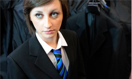 Female school student in a blazer and tie