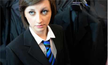 Female school student in a blazer and tie